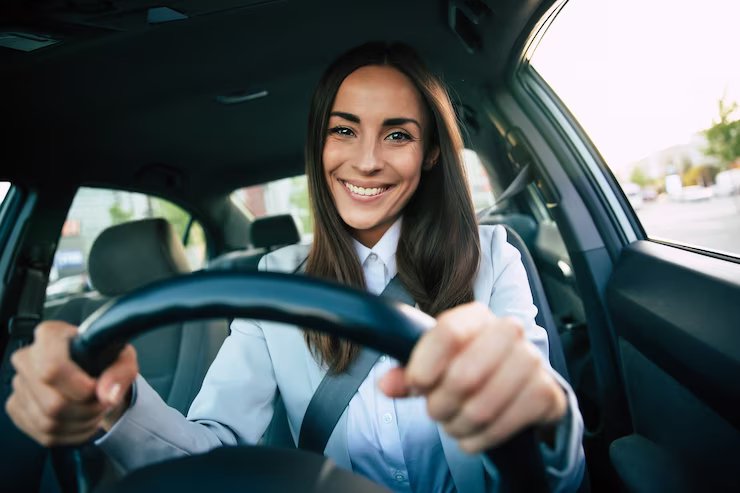 beautiful-happy-successful-businesswoman-is-driving-new-modern-car-good-mood-portrait-cute-female-driver-steering-car-with-safety-belt_283617-4040